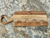 a wooden cutting board with the word egypt on it