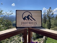 foothills adventures llc wooden sign